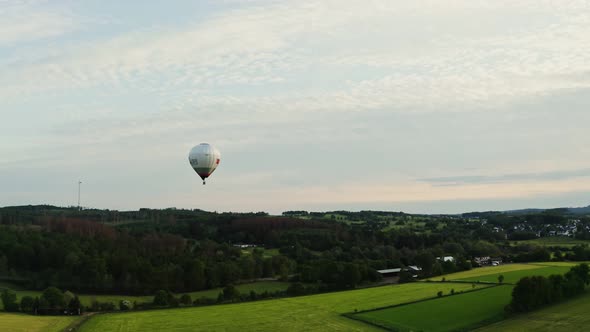 Hot Air Balloon in the Sky Flying Over Green Fields on a Sunny Day Germany