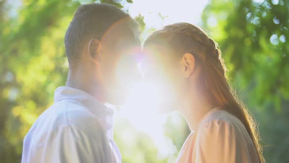 Sweet Teenage Couple Touching Foreheads at Sunny Day Park, First Relationship