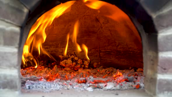 Flames playing in a wood fired pizza oven