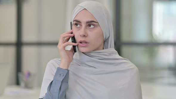 Aggressive Young Arab Woman Angry on Smartphone