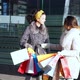 Two Cheerful Girlfriends Talking Near the Shop Window - VideoHive Item for Sale