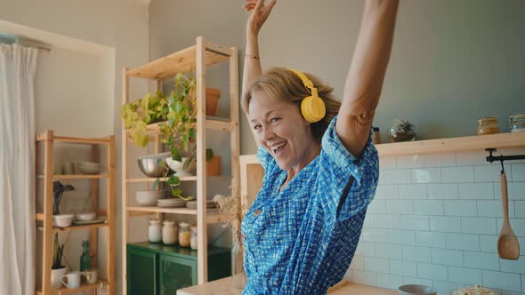 beautiful senior woman spending time in her house