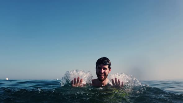 boy splash in the sea