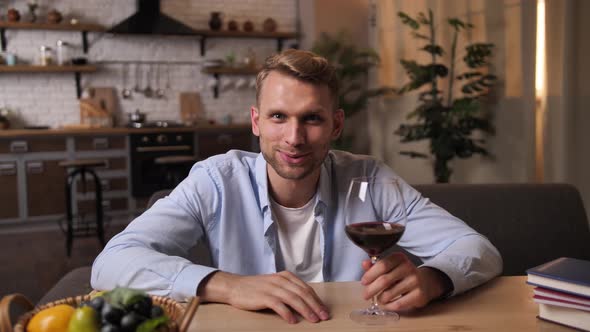 Handsome Man Clinking Glasses on Online Dating