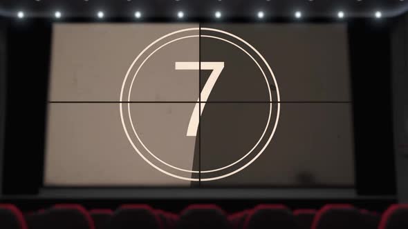 Film Countdown on the Cinema Screen in the Movie Theater Without Audience