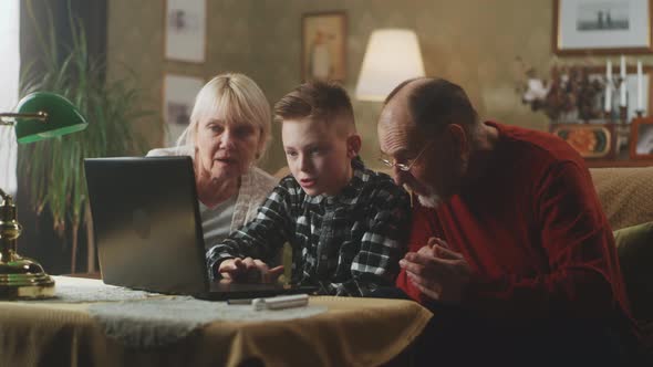 Grandparents and Grandson with New Laptop