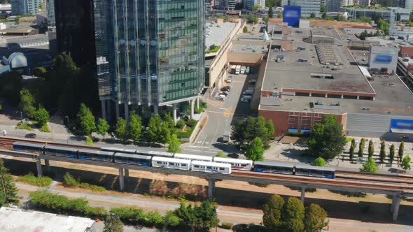 Aerial View Of SkyTrain Rapid Transit Traveling On The Expo Line In City Of Burnaby, Canada. - ascen