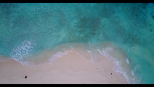 Aerial top view panorama of exotic shore beach voyage by transparent water with white sand backgroun