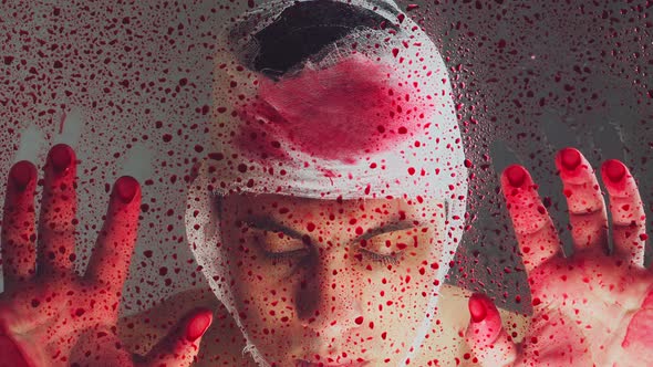 Portrait. The guy with the bandaged head covered in blood. The terrible consequences.