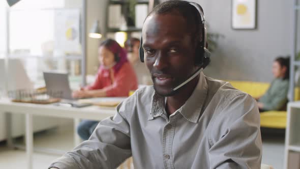 Portrait of Afro-American Call Center Agent in Headset