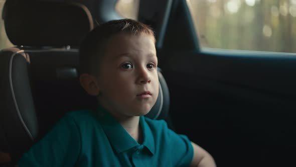 Closeup of a Boy Traveling By Car