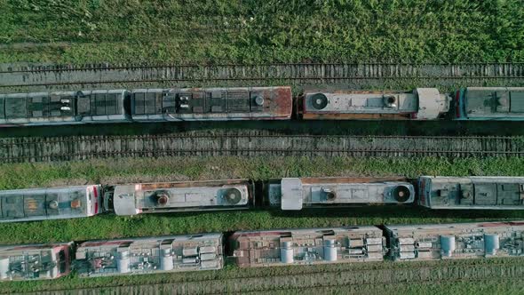 Aerial Top Down Shot of an Abandoned Rusty Locomotives and Old Railways