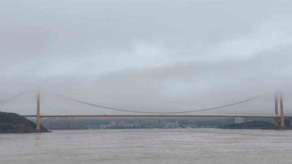 Bridge cross the sea in fog