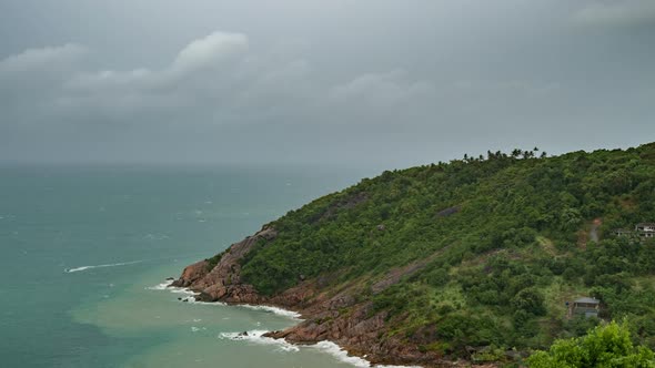 Dark Rainy Clouds Over Tropical Sea with Rock Mountain in Koh Phangan Island, Thailand