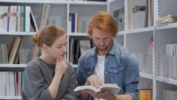 Serious Students Searching Information in Book  in Library