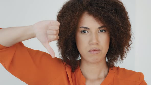 Close Up Angry Unsatisfied African Woman with Curly Hair Displeased Unhappy Girl Looking Camera