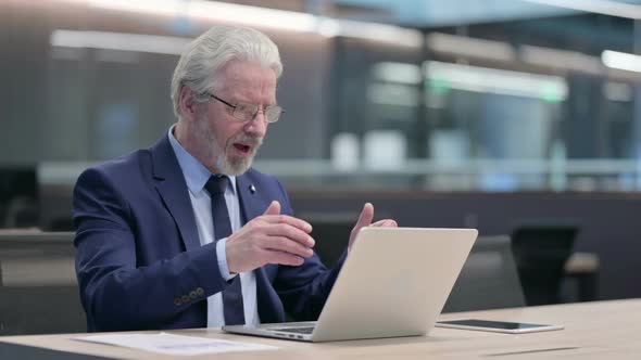 Successful Old Businessman Celebrating on Laptop at Work