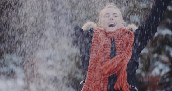 Handful Of Snow - Positive Woman Throwing Snow