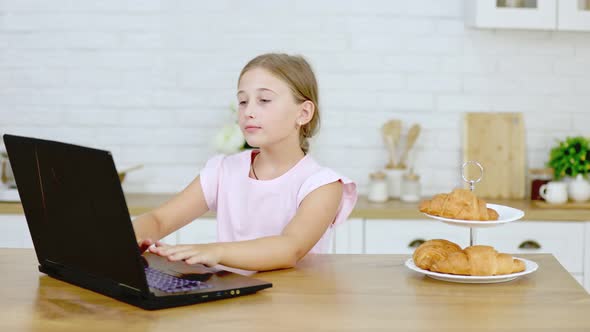 Girl Looking at Laptop