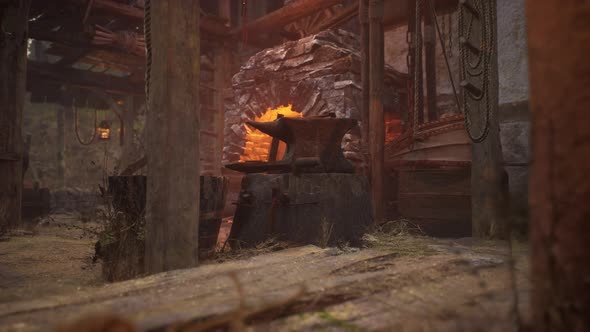 Old Abandoned Blacksmiths Workshop with Rusted Anvil Hammer and Tools