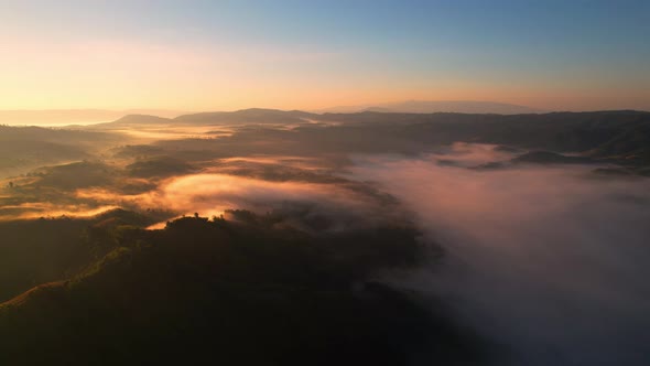 4K Aerial Flying Above Sea of Fog at Sunrise