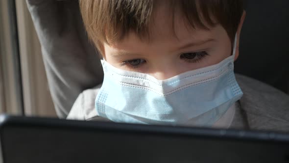 Face of Boy in Medical Mask Close Up. Stay at Home Quarantine Coronavirus Pandemic Prevention. Child