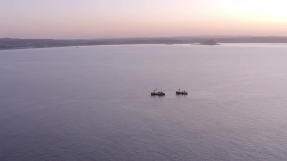 Fishing Trawlers at Sea in the Early Morning Aerial View