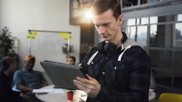 Focused Business Man Working on the Tablet