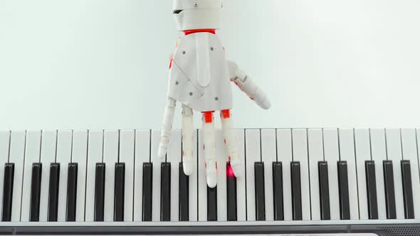 Robotic Prosthesis Hand Is Playing the Piano Trying To Press the Right Keys.