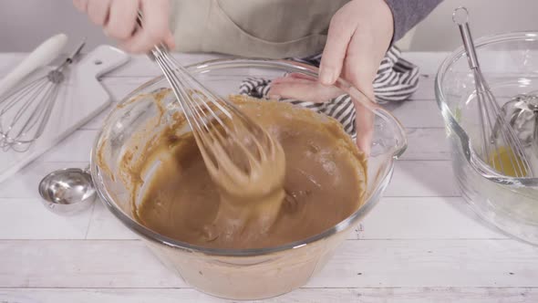 Mixing ingredients to bake chocolate raspberry cupcakes.