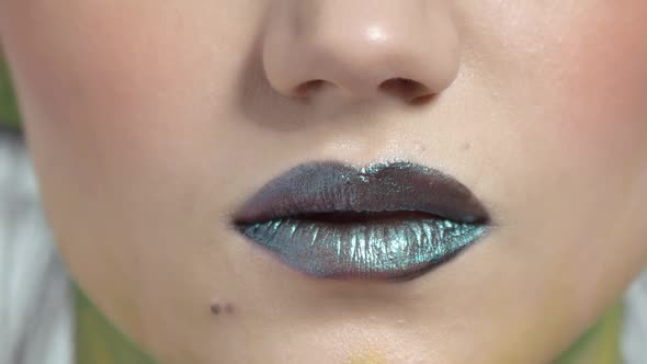 Dark Lips of Young Woman.