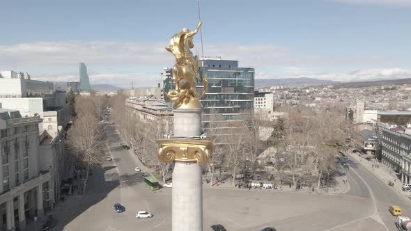 Flying over column of freedom in the center of Tbilisi, Georgia