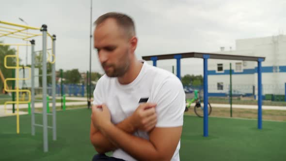 Fitness Man Doing Situps Floor Exercises at Outside