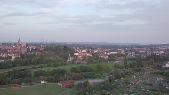 Wide sunset aerial across the beautiful city of Exeter, Devon