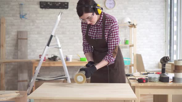 Portrait of Professional Young Carpenter Woman Working with Wood