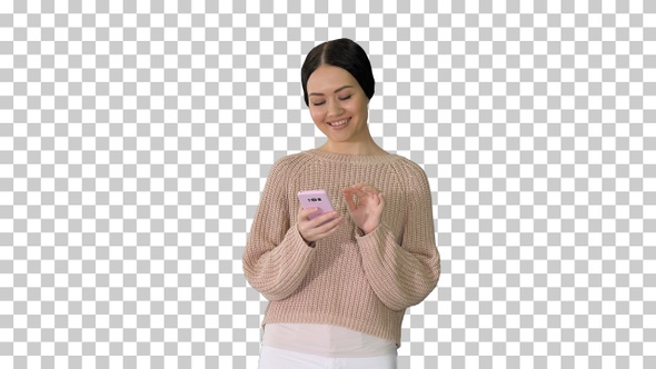 Smiling young female texting on her mobile, Alpha Channel