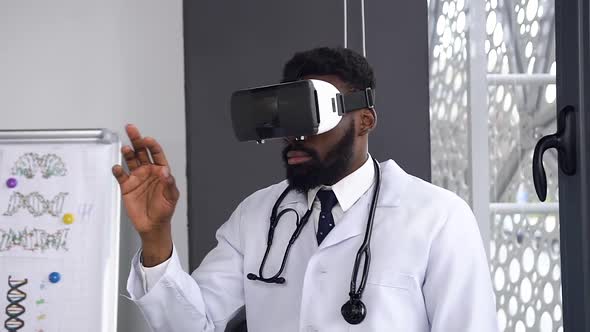 Afro American Scientist Using and Testing Virtual Reality Glasses While Working in Hospital