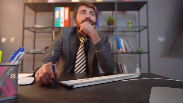 Bored businessman at the computer