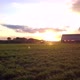 Aerial Cinematic Clip Drone Flying Over a Farm Field During Sunset - VideoHive Item for Sale