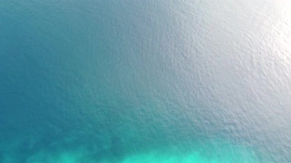 Aerial flight over incredible coral reefs and deep blue ocean of coral triangle in Timor Leste, Sout