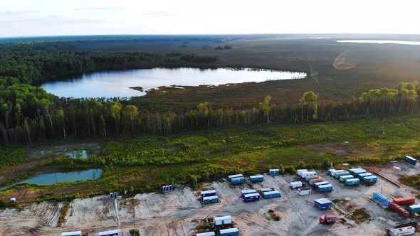 The Drone Flies Over Working Mobile Homes Which are Located on the Shore of the Lake