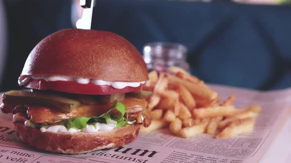 fried chicken and cheese burger with french fries