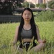 Young Asian Woman Was Sitting in Yoga in the Garden She Was Relaxed and Enjoyed the Workout - VideoHive Item for Sale