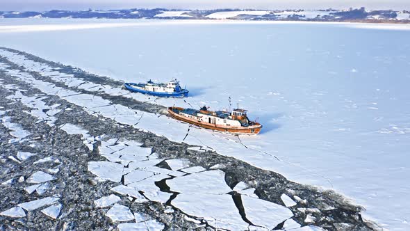 Icebreakers on Vistula river crush ice, Plock, 2020-02-18, Poland