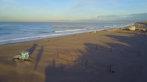 Aerial drone uav view of a volleyball court on the beach and ocean.