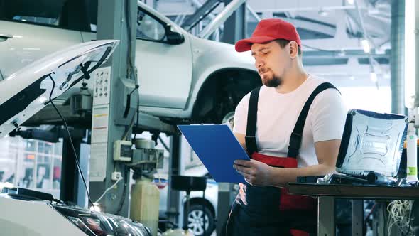 Car Repair Master Taking Notes