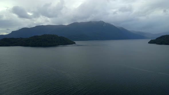 Aerial view truck left of Las Cabras Island in Hualaihue, Chile on a cloudy day.