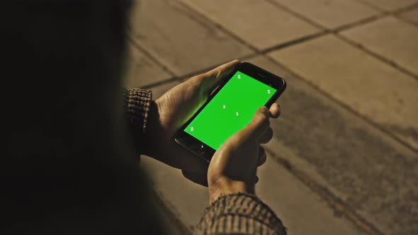 Man Using Chroma Key Smartphone While Standing Gesturing Swiping Scrolling