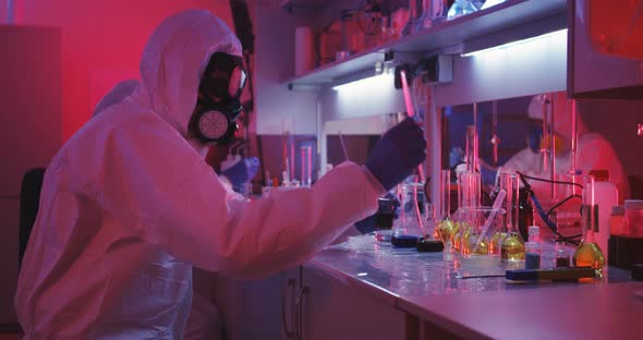 Scientists Working in Laboratory in Red Light