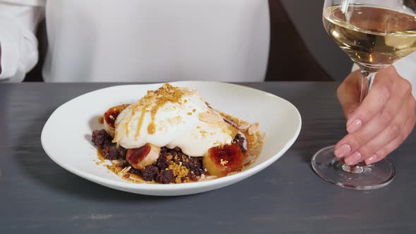 Young Beautiful Woman Eating a Dessert in Modern Restaurant High Kitchen Ice Cream Famous Chef